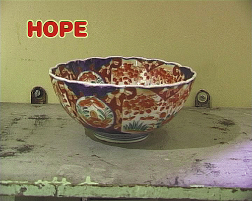 Video still showing an ornate bowl with the word 'hope' above it