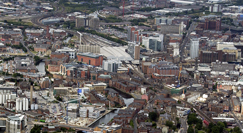 An arial photograph of Leeds city centre showing the traiin station